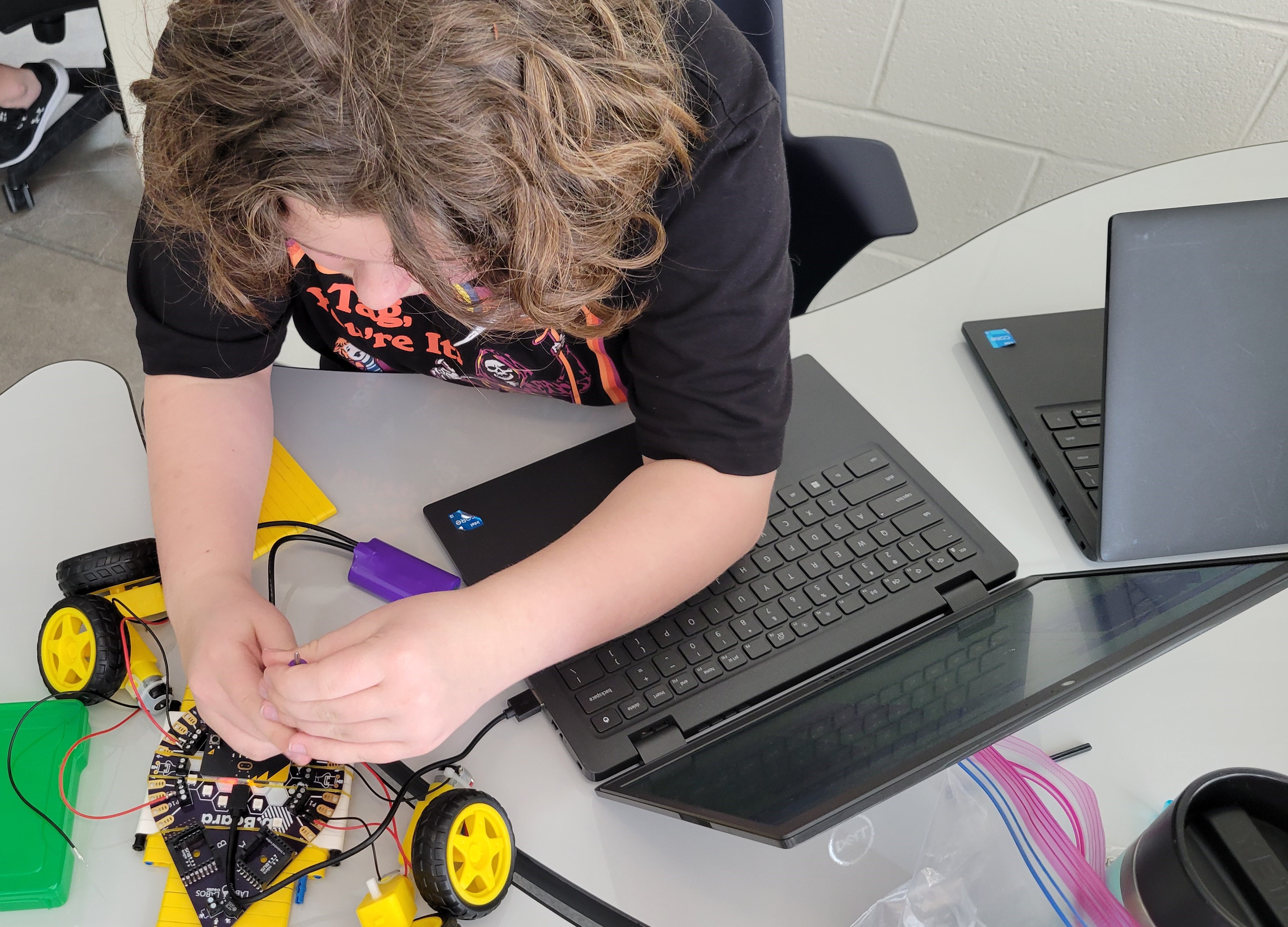 Student working on a b.Board for their Mission:Mars Innovation Fair project